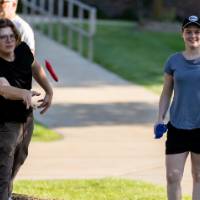 Students playing cornhole on Kirkhof Lawn.